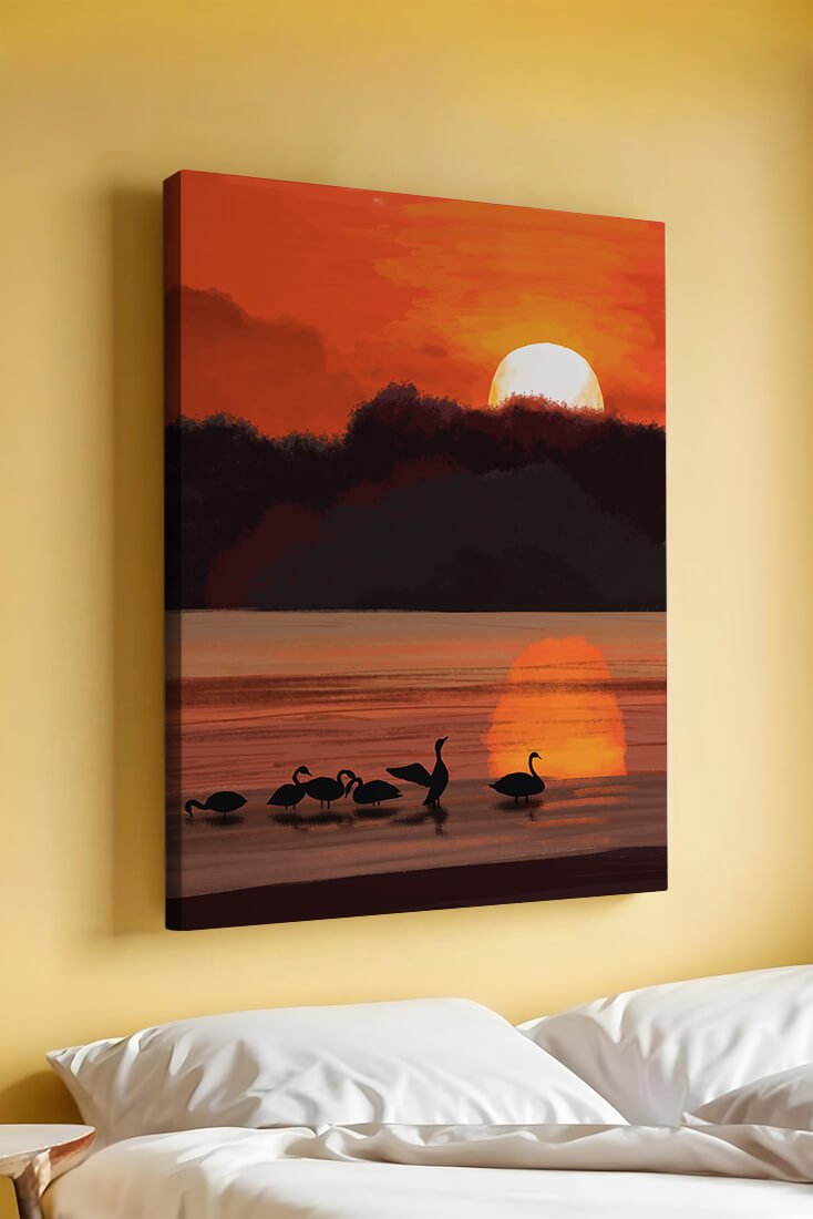 Serene sunset over a lake with silhouetted swans
