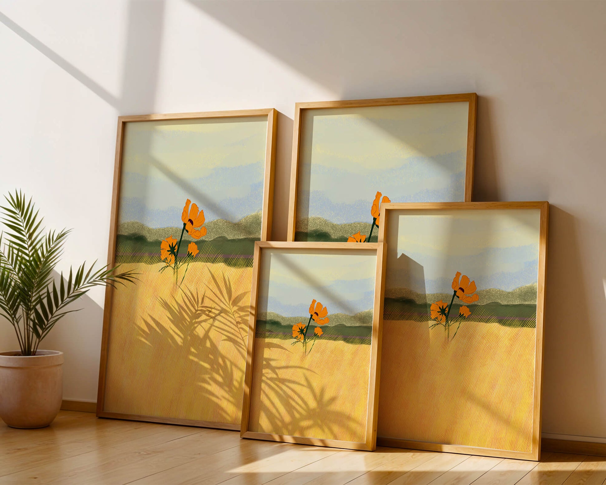 Orange Flowers in a Golden Field with Mountains and Blue Sky