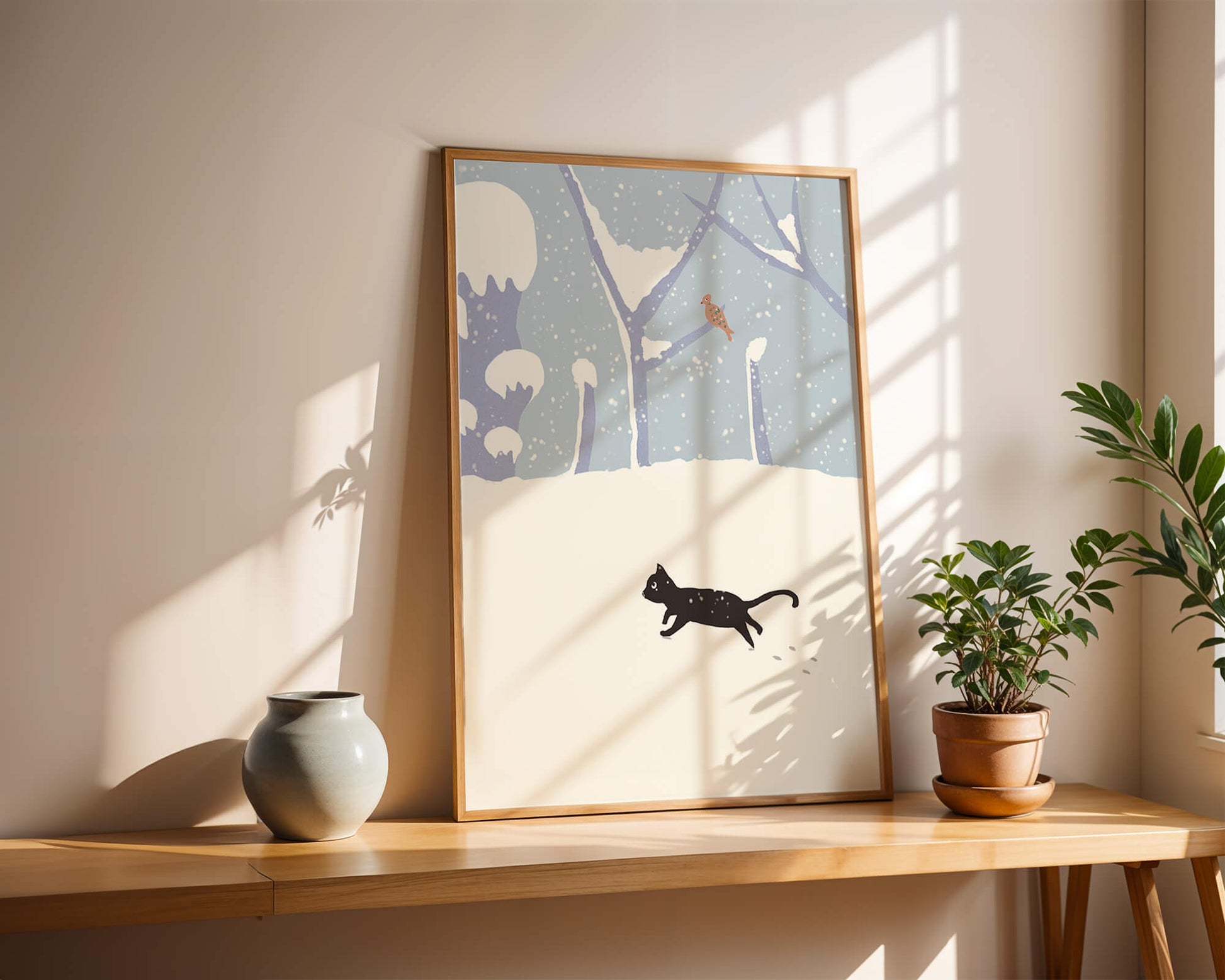 Illustrated snowy landscape with playful black cat and bird in winter scenery