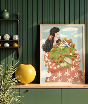 Femme fantaisiste tenant un paysage miniature avec famille et maisons