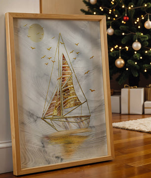Elegant sailboat with gold elements against a textured sky