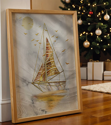 Elegant sailboat with gold elements against a textured sky