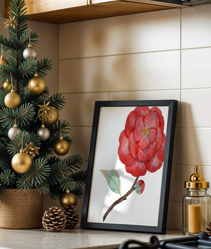 Watercolor illustration of a red camellia flower with green leaves