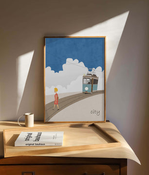 Urban scene with tram and pedestrian under a blue sky
