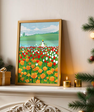 Woman with bicycle in vibrant tulip field by a lake