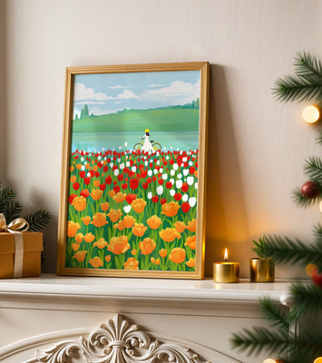 Woman with bicycle in vibrant tulip field by a lake