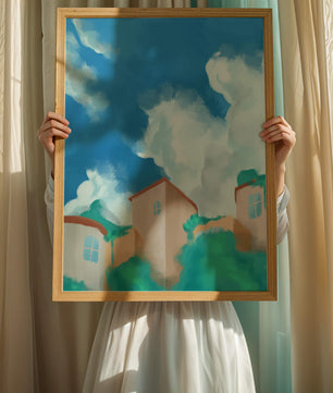 Serene landscape with houses and fluffy clouds against a blue sky