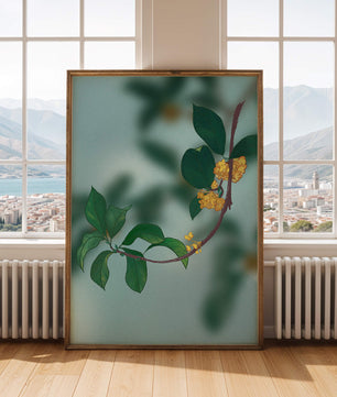 Rama con flores amarillas y hojas verdes sobre un fondo azul claro