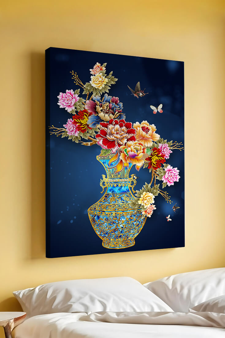 Elegant floral arrangement in ornate gold-accented vase with butterflies