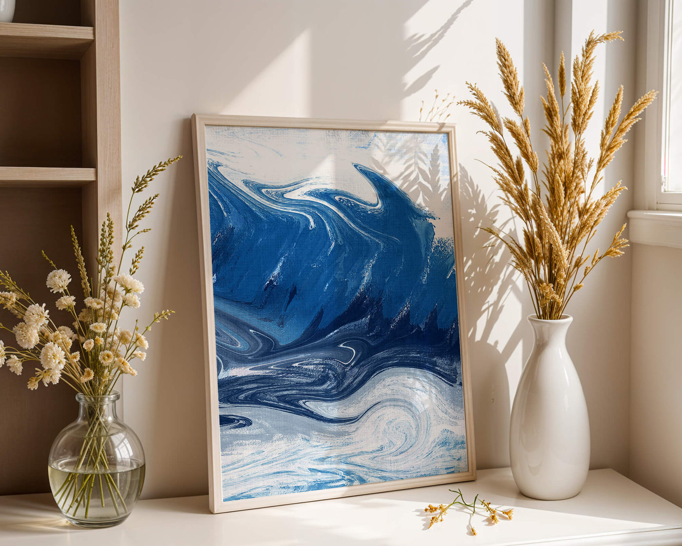 Abstract blue and white ocean wave painting with swirling patterns