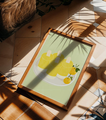 Illustration of yellow popsicles and oranges on a plate