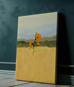 Orange Flowers in a Golden Field with Mountains and Blue Sky
