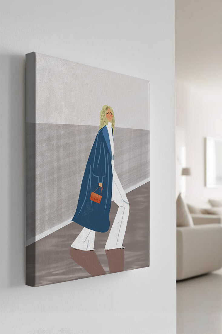Fashionable Woman in Long Blue Coat Walking Along Corridor with Orange Handbag