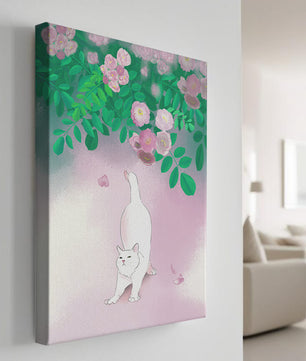 White cat stretching beneath blooming flowers in a pastel garden setting