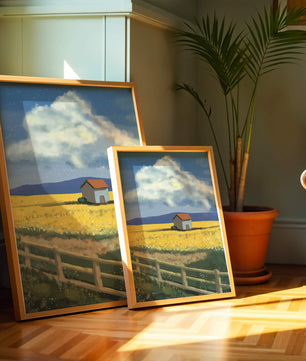Idyllic rural scene with house and yellow field under blue sky