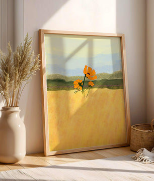 Orange Flowers in a Golden Field with Mountains and Blue Sky