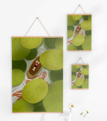 Person in boat among lush green lily pads