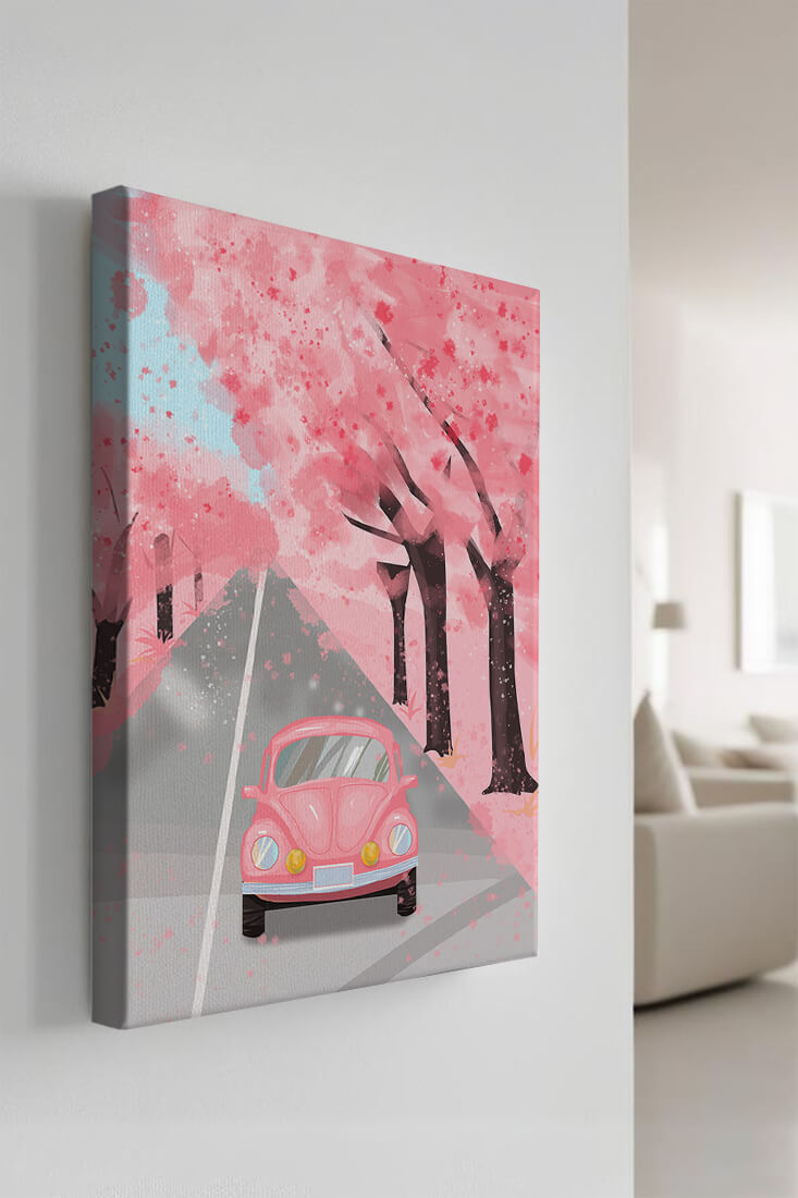 Pink vintage car on a cherry blossom road
