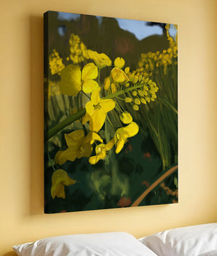 Close-up view of vibrant yellow flowers in a lush green field