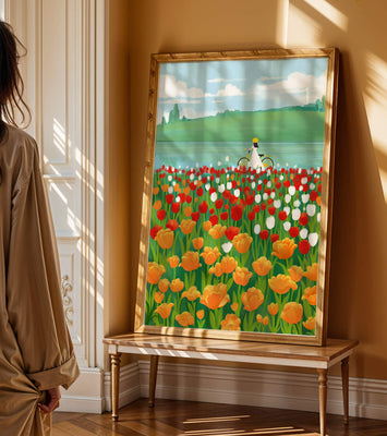 Woman with bicycle in vibrant tulip field by a lake