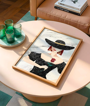 Elegant woman in wide-brimmed hat holding a rose on marble background