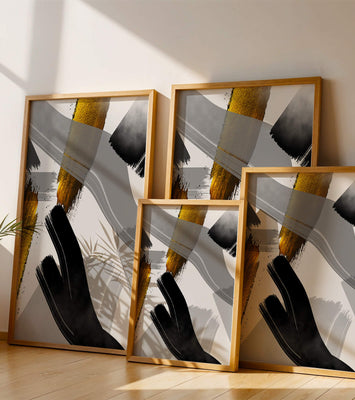 Abstract art piece with gold and black brushstrokes on a gray background