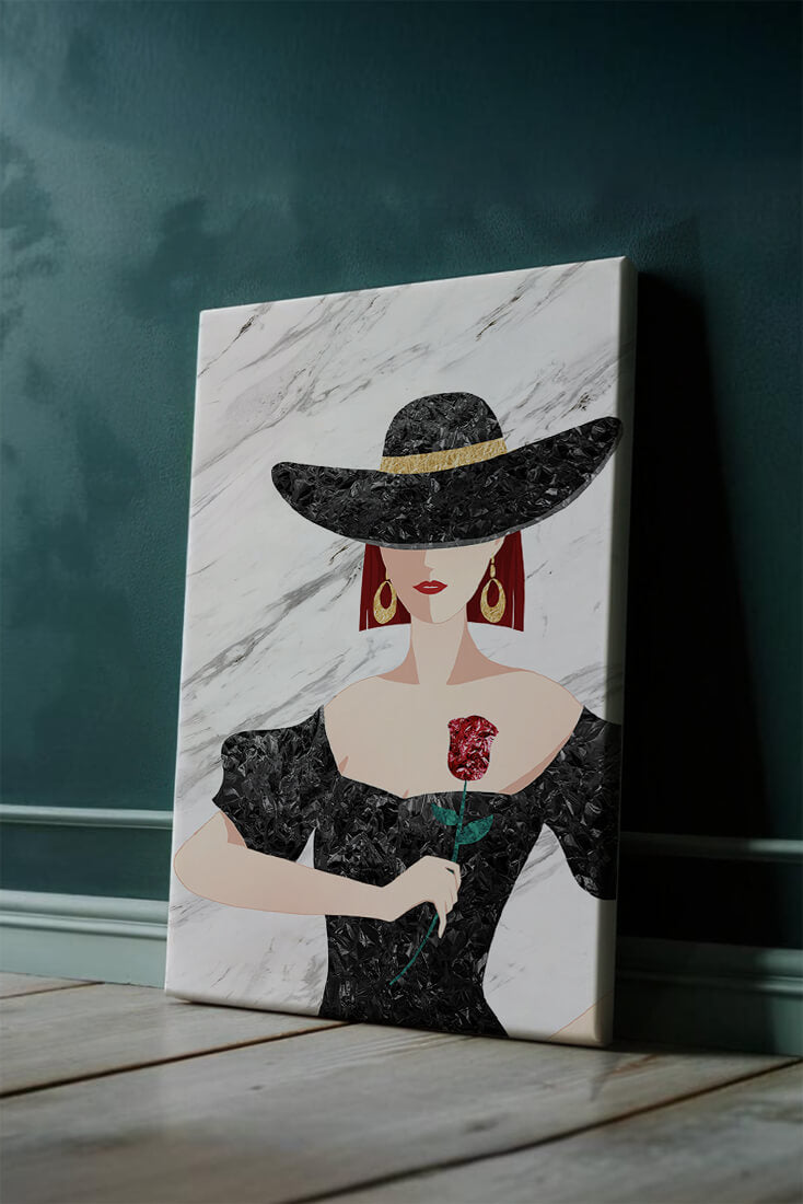 Elegant woman in wide-brimmed hat holding a rose on marble background