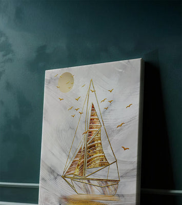 Elegant sailboat with gold elements against a textured sky
