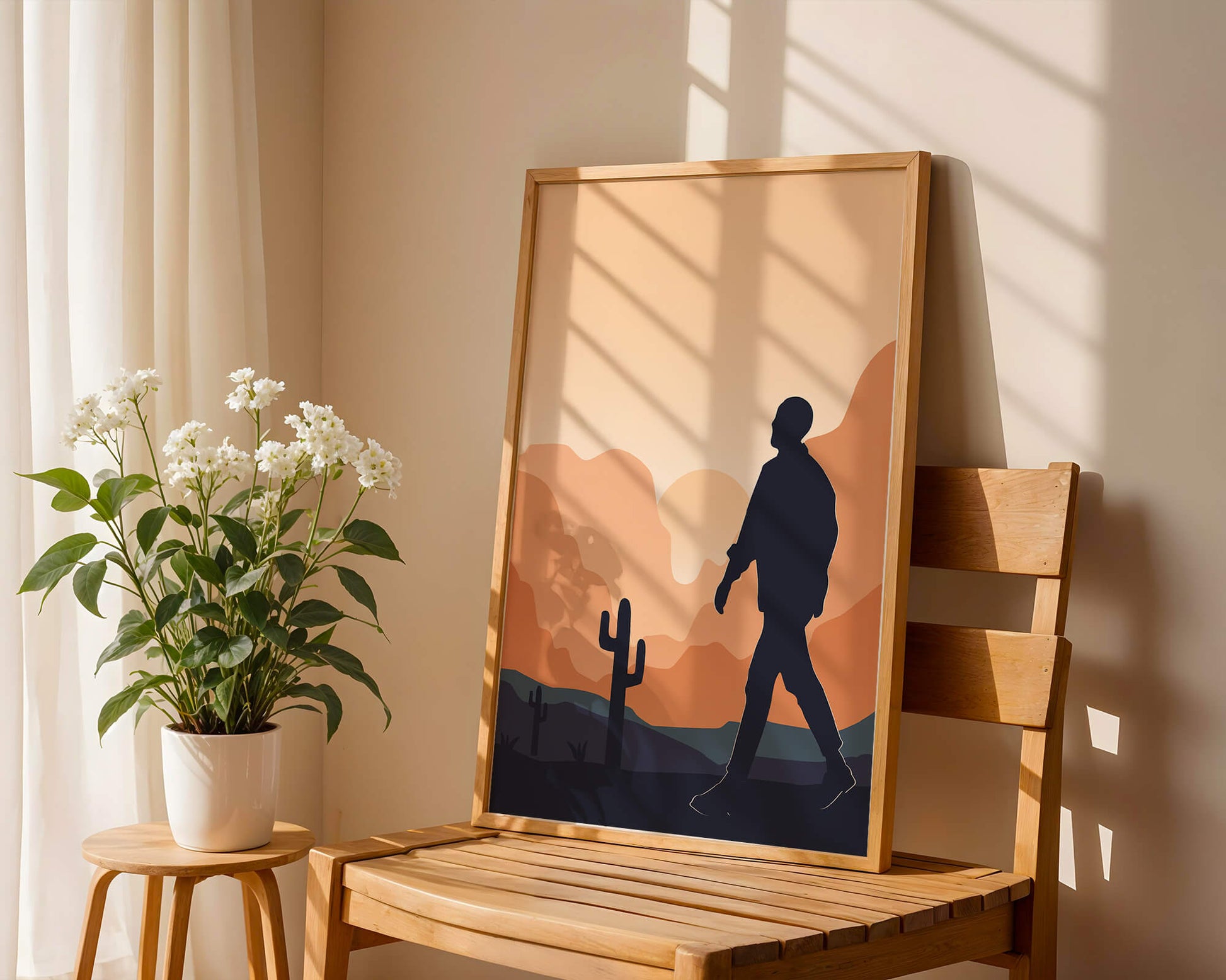 Silhouetted figure walking in desert landscape at sunset