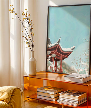 Snow-covered traditional pagoda under a clear blue sky
