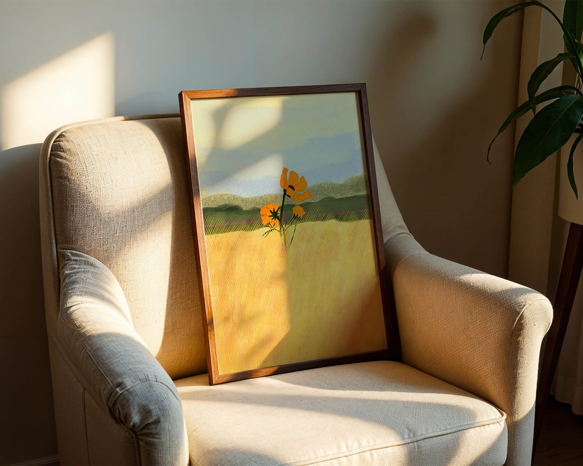 Orange Flowers in a Golden Field with Mountains and Blue Sky