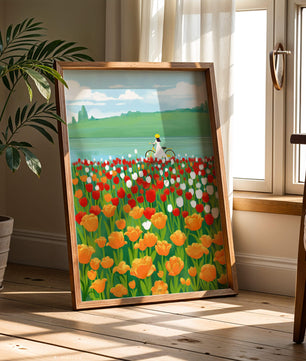 Woman with bicycle in vibrant tulip field by a lake