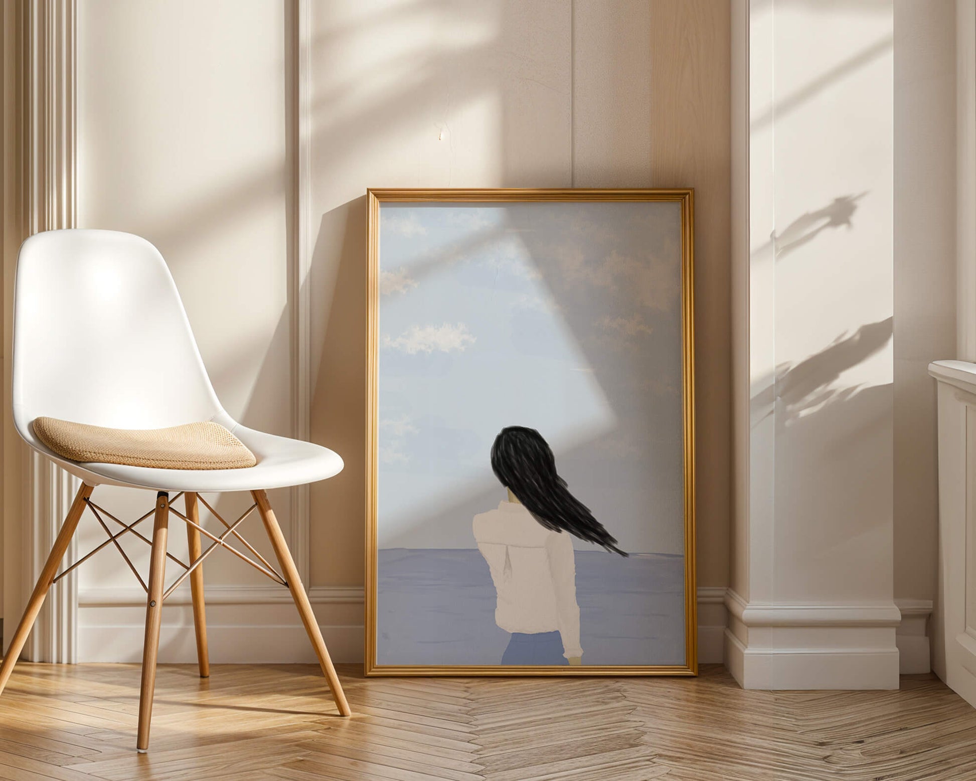 Woman gazing at the ocean with blue sky and clouds
