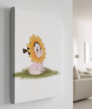 Adorable child with sunflower costume sitting on a grassy patch