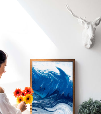 Abstract blue and white ocean wave painting with swirling patterns