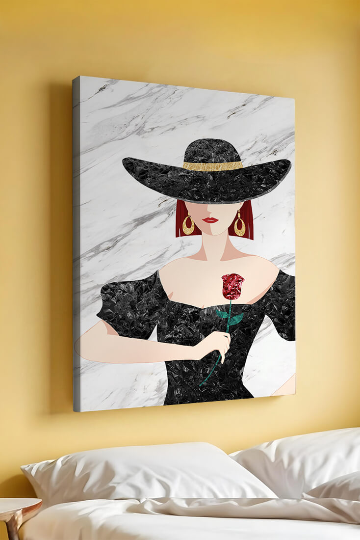 Elegant woman in wide-brimmed hat holding a rose on marble background