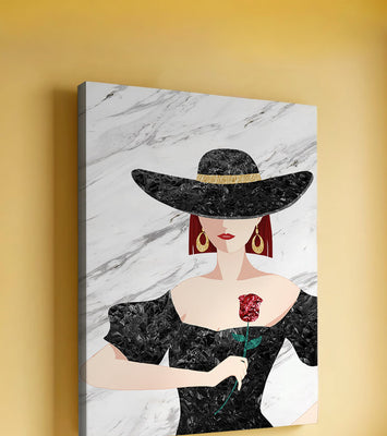 Elegant woman in wide-brimmed hat holding a rose on marble background