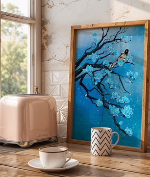 Bird on a branch with blue flowers against a snowy background