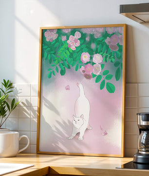 White cat stretching beneath blooming flowers in a pastel garden setting