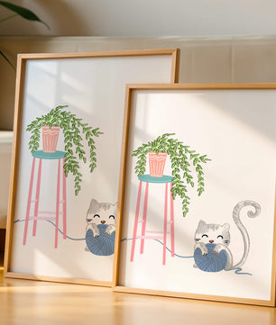 Cat Playing with Yarn Beside a Potted Plant on Pink Stool - Mi tienda