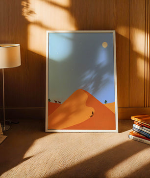 Serene desert landscape with dunes, camels, and a lone traveler under a starry sky