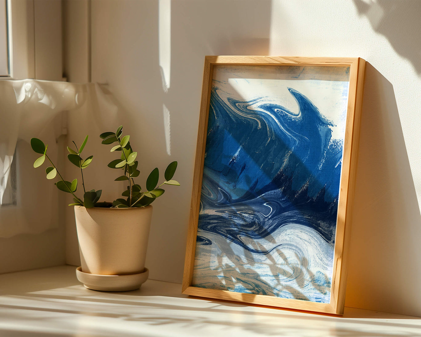 Abstract blue and white ocean wave painting with swirling patterns