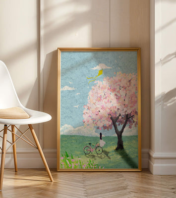 Springtime scene with cherry blossom and girl with bicycle