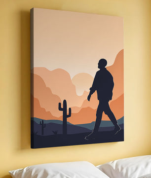 Silhouetted figure walking in desert landscape at sunset