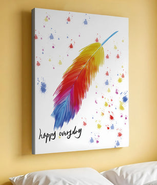 Colorful feather with inspirational message on abstract paint splatter background