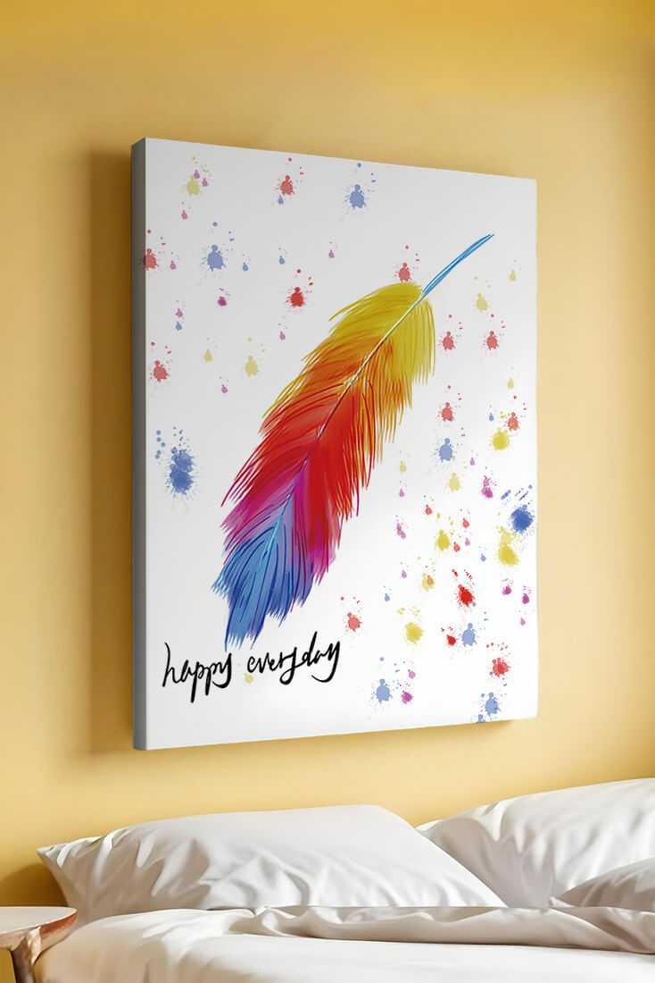 Colorful feather with inspirational message on abstract paint splatter background