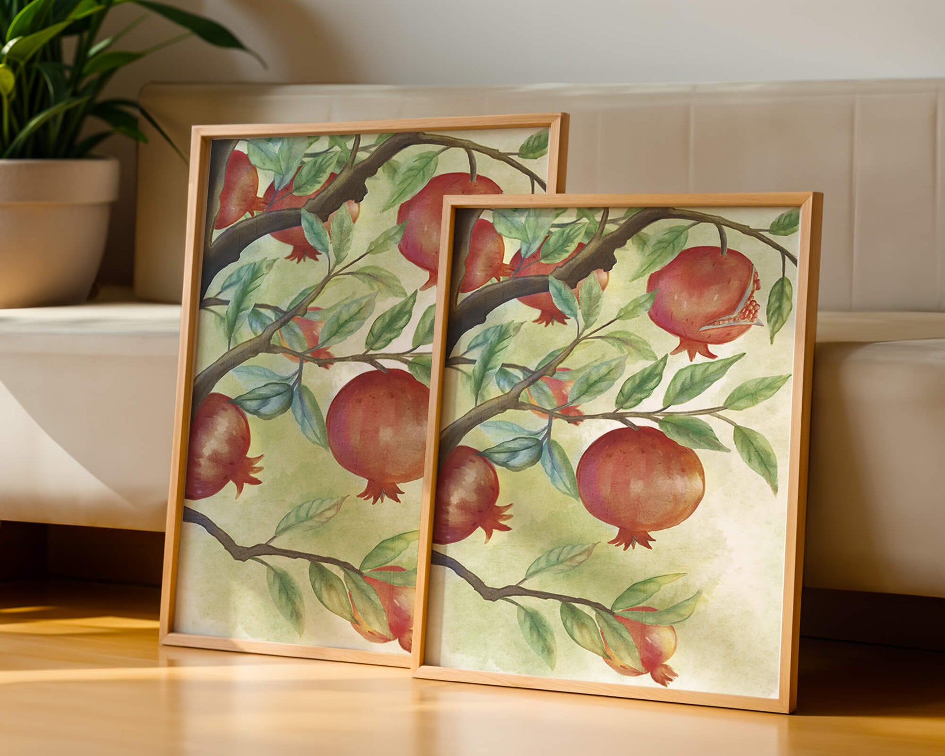 Watercolor illustration of pomegranates on a branch with leaves