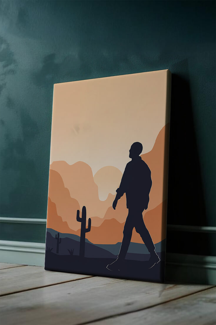 Silhouetted figure walking in desert landscape at sunset