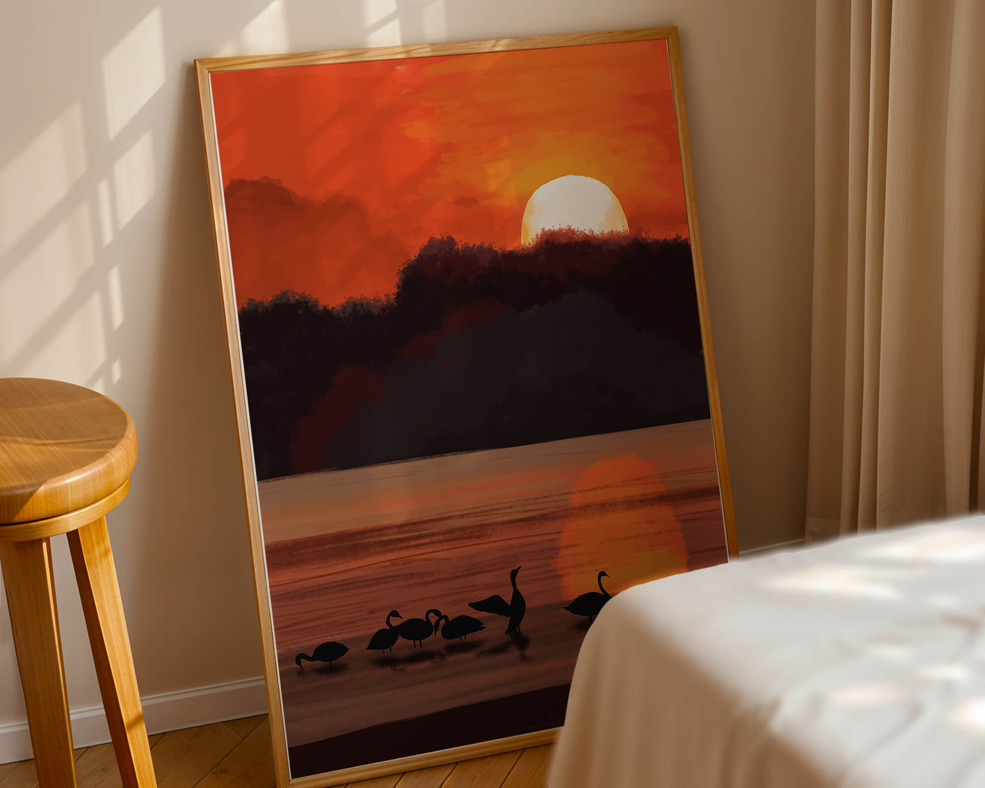 Serene sunset over a lake with silhouetted swans