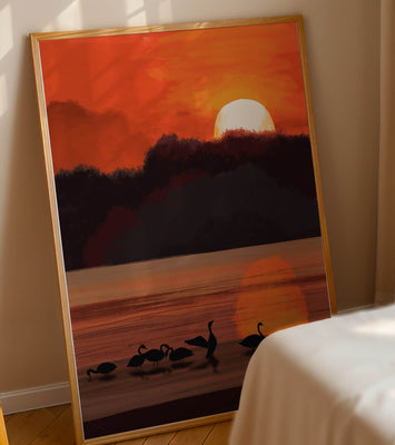 Serene sunset over a lake with silhouetted swans